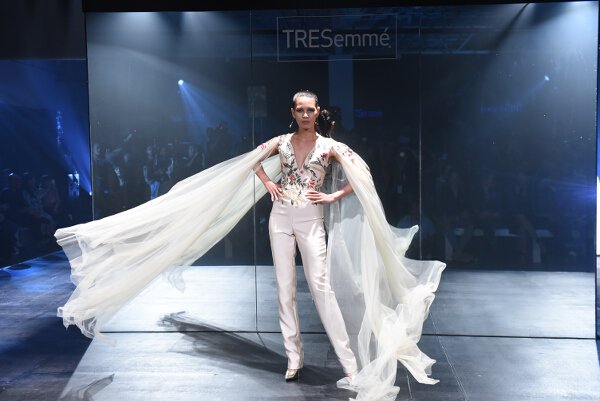 Mark Bumgarner interprets modern elegance in red and nude softly structured ensembles with his signature feminine touch.