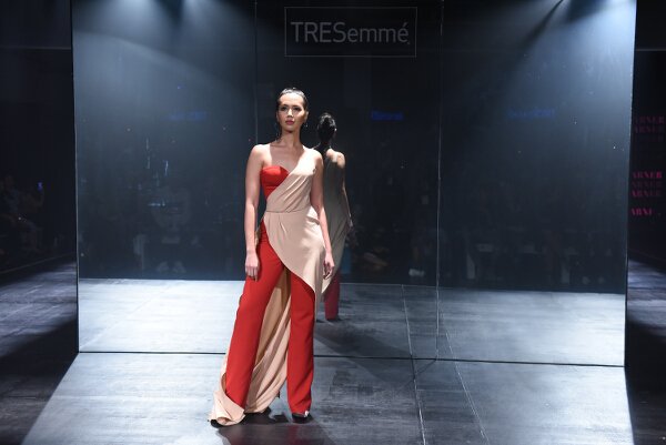 Mark Bumgarner interprets modern elegance in red and nude softly structured ensembles with his signature feminine touch.