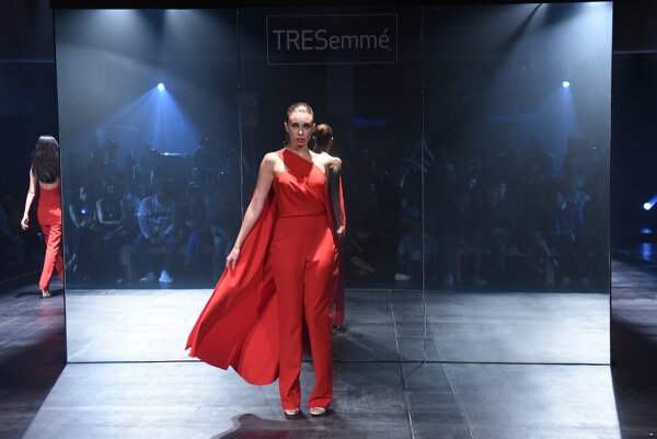 Mark Bumgarner interprets modern elegance in red and nude softly structured ensembles with his signature feminine touch.