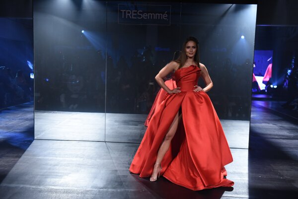 I absolutely adore this Mark Bumgarner gown modeled by Sarah Lahbati. In ivory, it would be a lovely bridal gown!